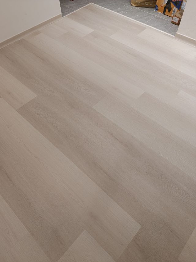 SPC flooring, living area — real Chapter One Reno project photo, Kuching