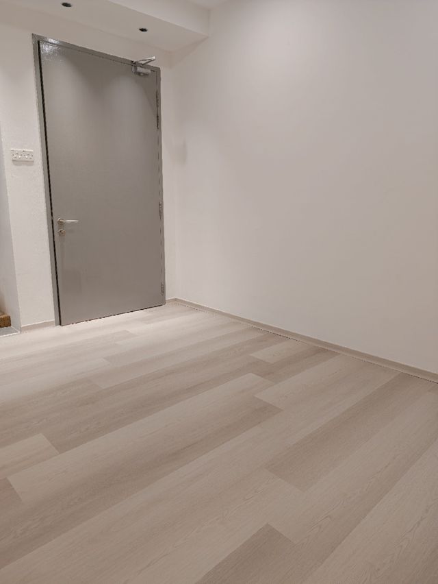 Flooring by doorway — real Chapter One Reno project photo, Kuching