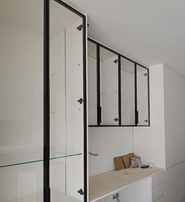Glass-front cabinetry installation in progress, Kuching