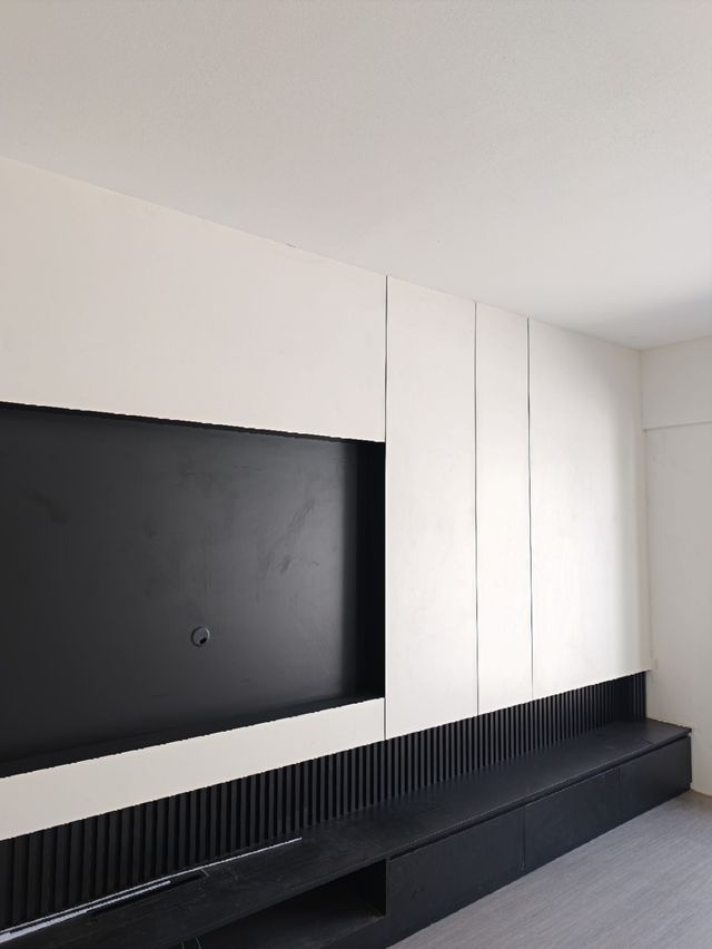 TV feature wall, completed — real Chapter One Reno project photo, Kuching