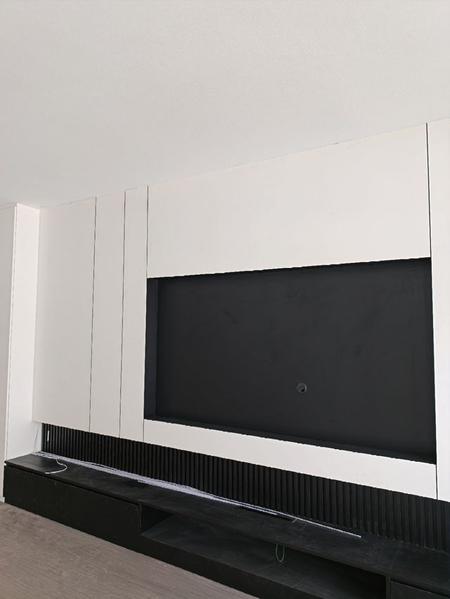 TV feature wall, alternate angle — real Chapter One Reno project photo, Kuching