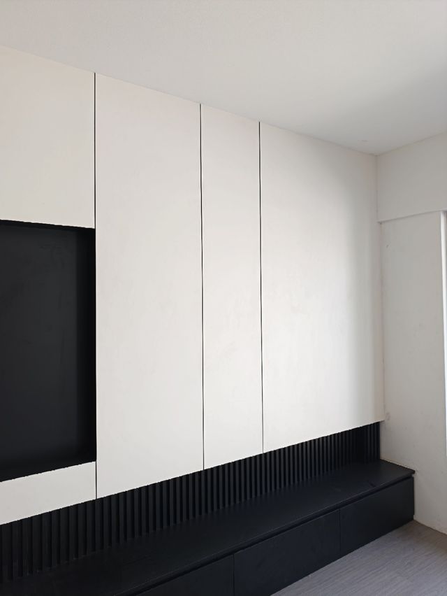 TV feature wall, bench detail — real Chapter One Reno project photo, Kuching